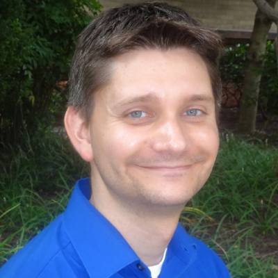 Jared W. Keeley, Ph.D., in front of greenery