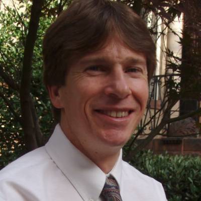 Scott Vrana, Ph.D., in front of greenery